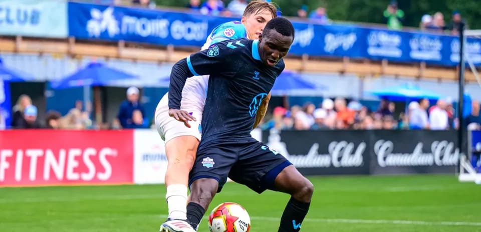 Players competing for the ball during match