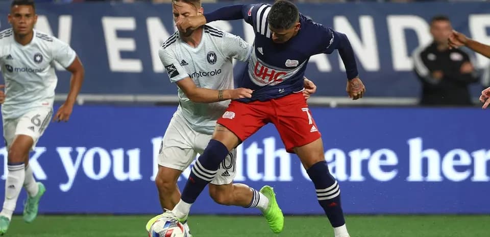 Players contesting for the ball during match