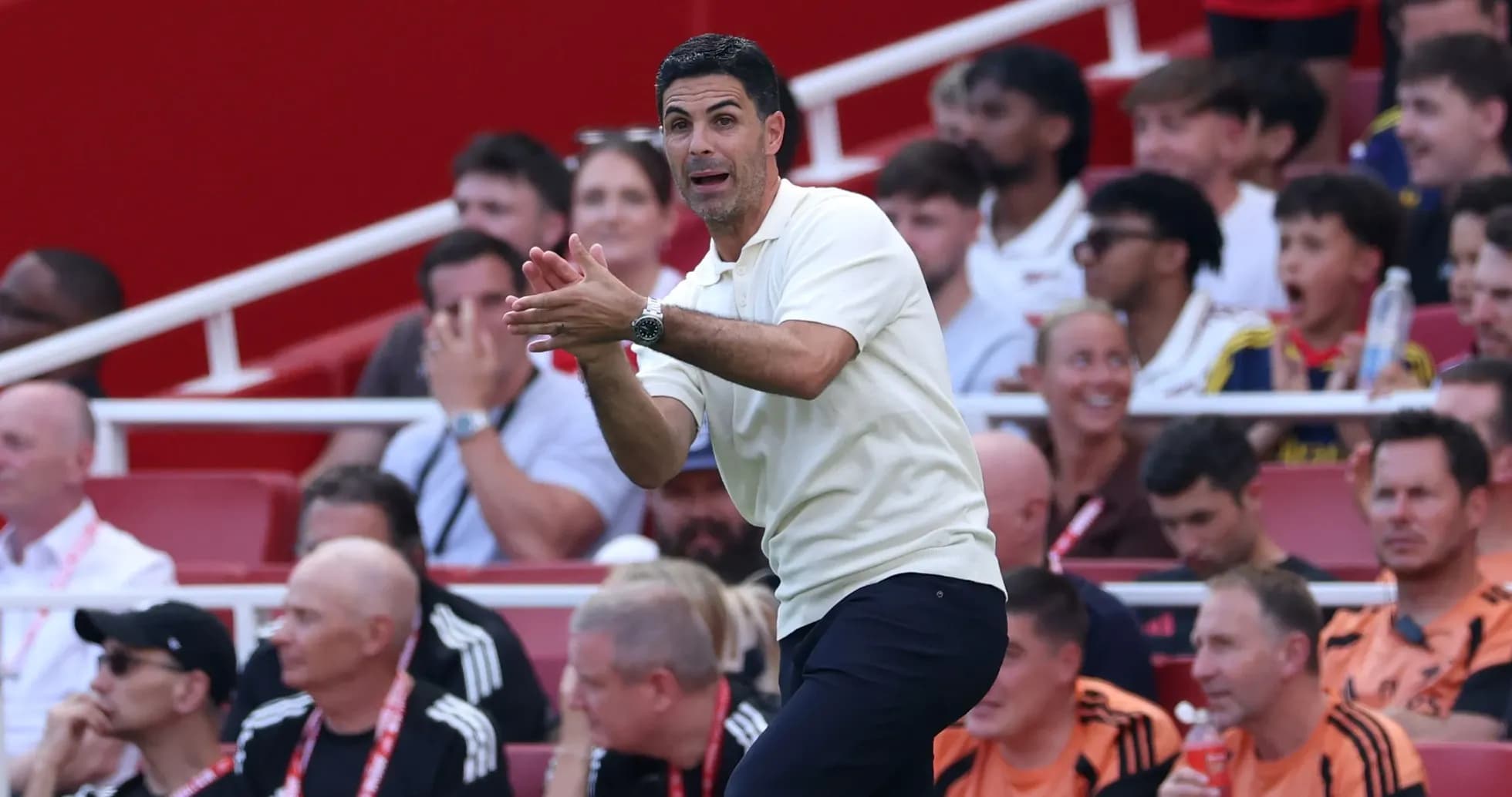 Coach gesturing on the sidelines during match