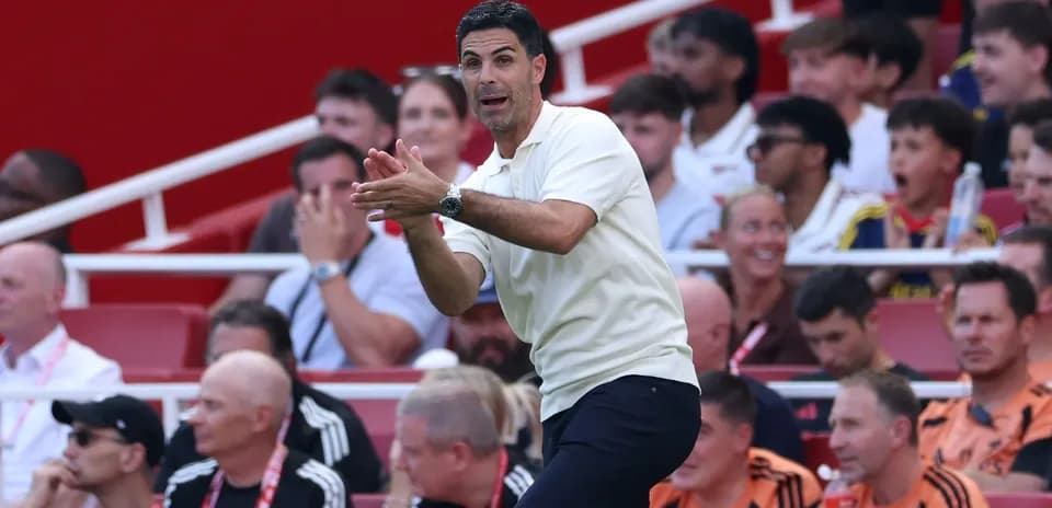 Coach gesturing on the sidelines during match