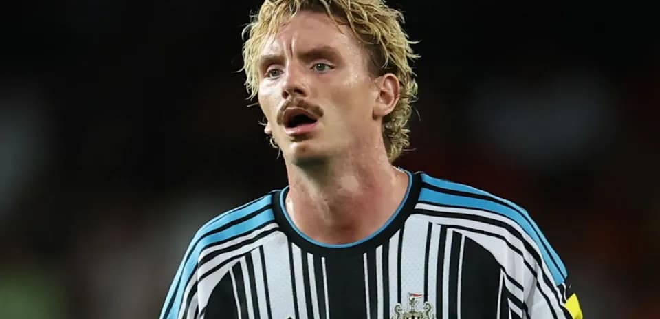 Player wearing Newcastle United kit during match