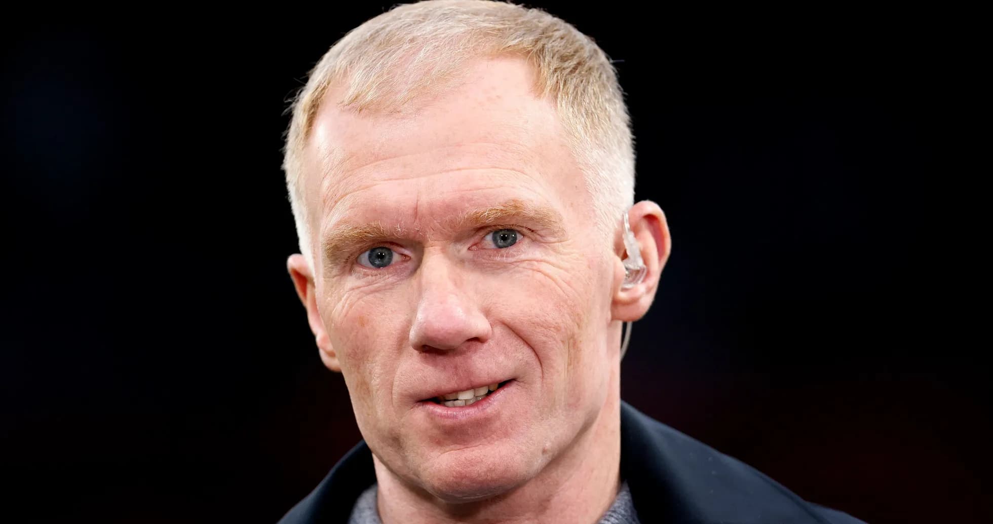 Man with short blonde hair speaking at event