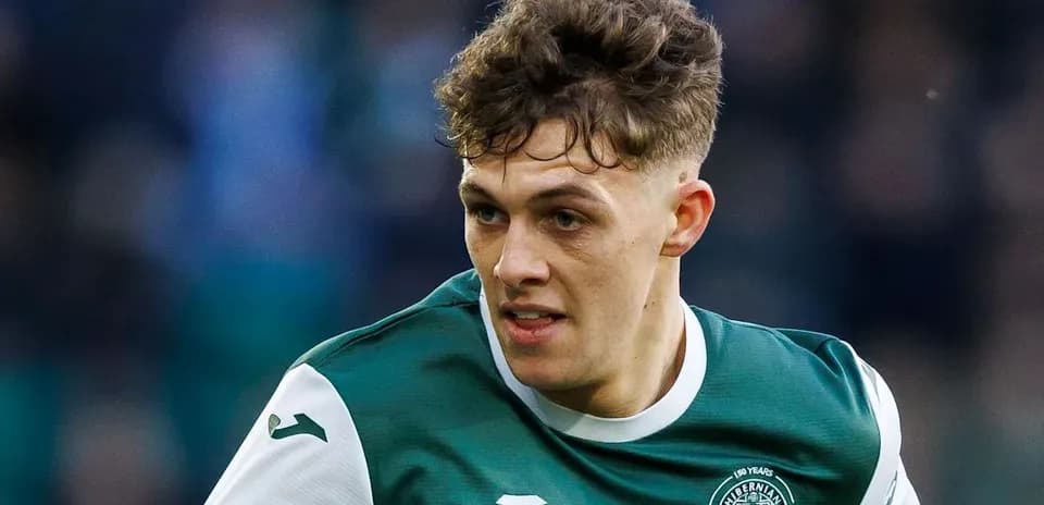 Player in Hibernian kit during match action