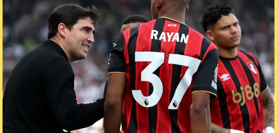 Manager discussing strategy with AFC Bournemouth players