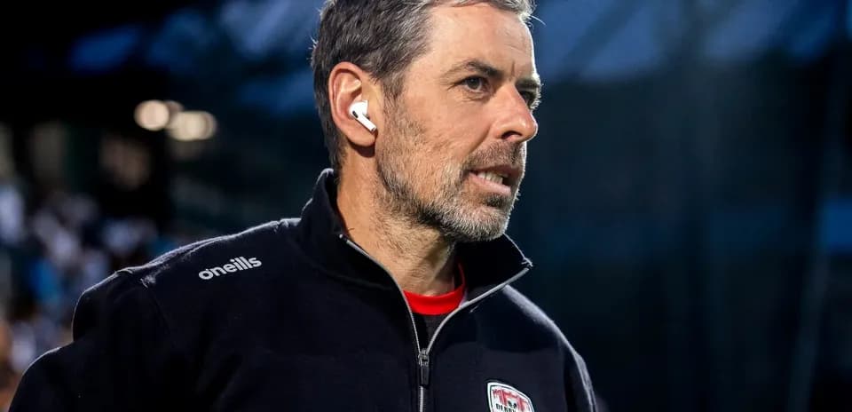 Coach wearing earphones during a match