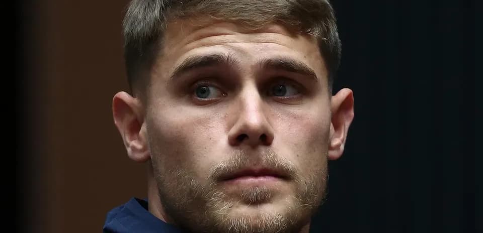 Player wearing Spurs jacket at event
