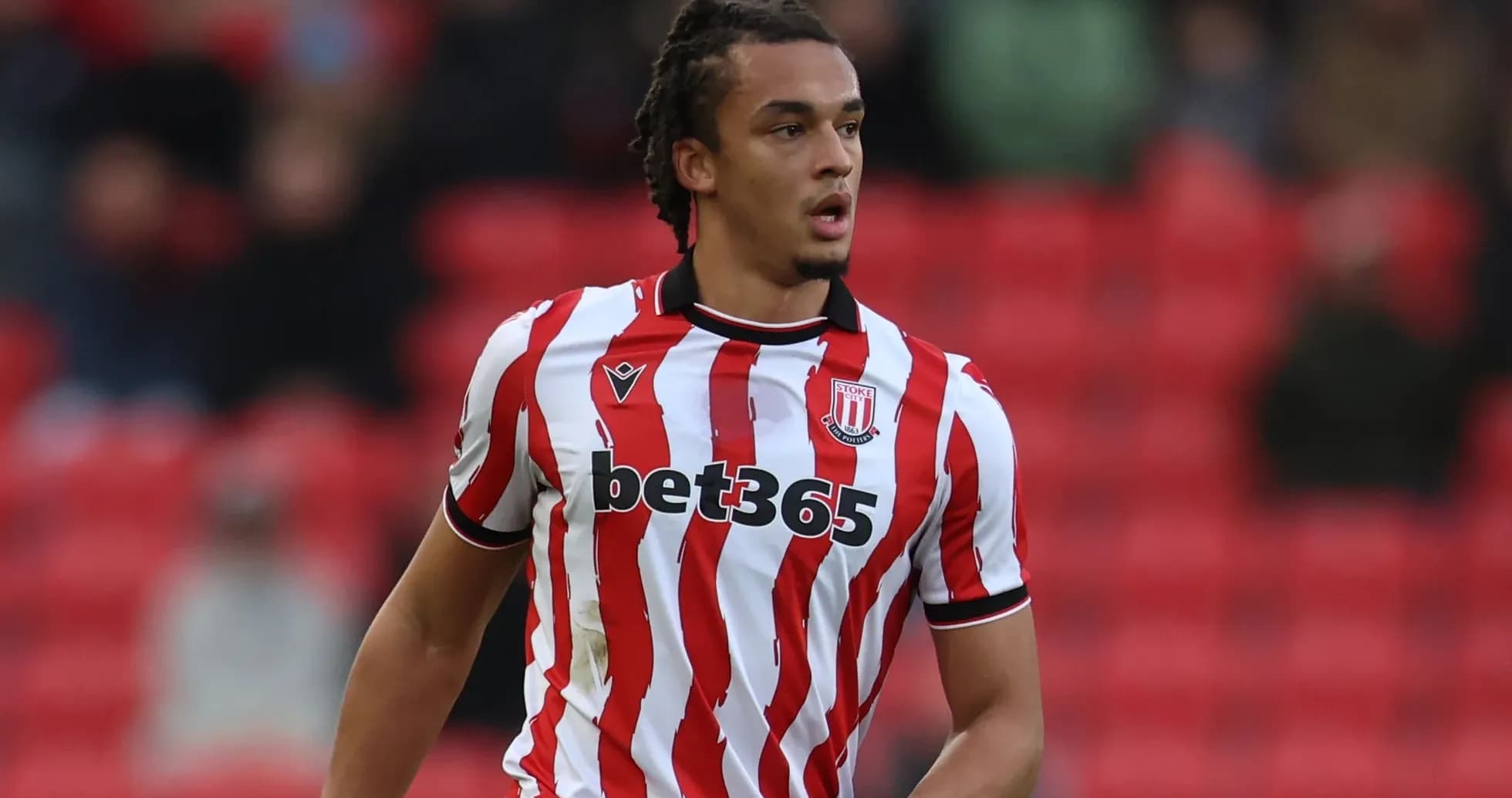 Player in Stoke City kit during match action