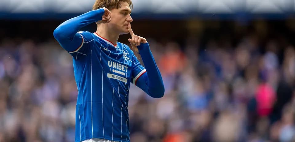 Player gesturing for silence during match celebration