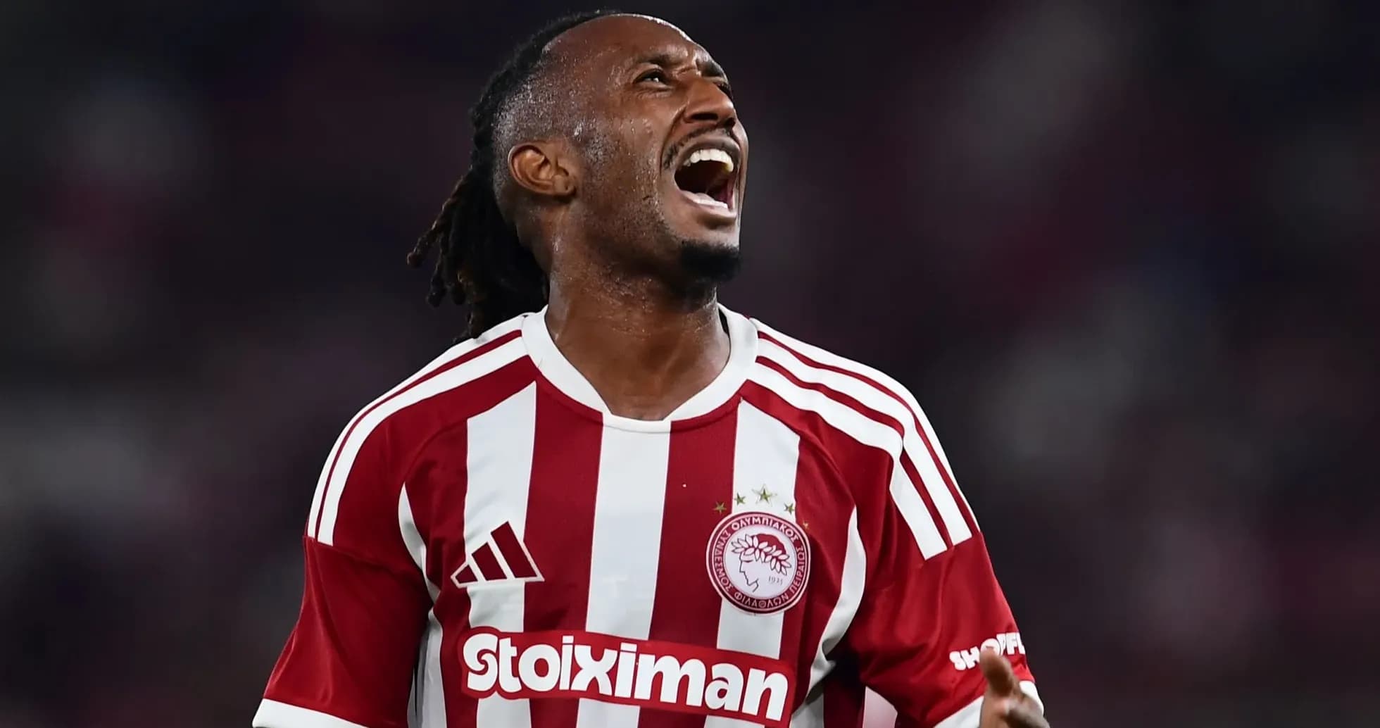Olympiakos player celebrating during a match