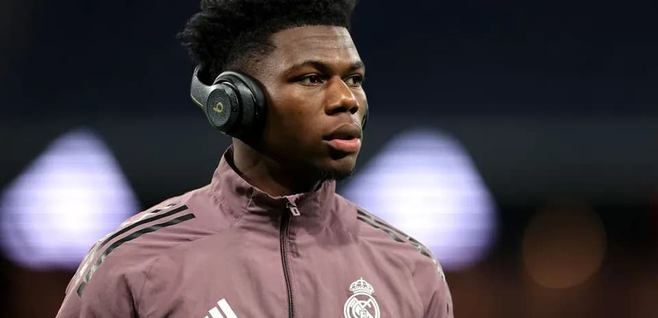 Player wearing headphones during warm-up at stadium