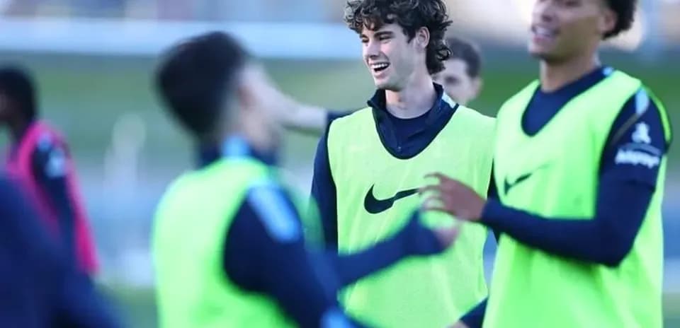 Players wearing training vests during warm-up session