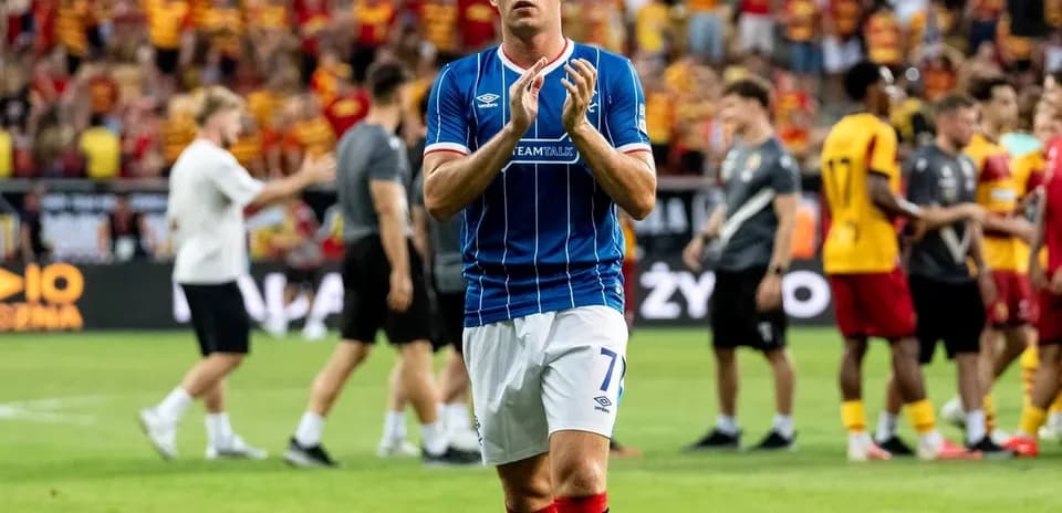 Rangers player applauding fans after the match