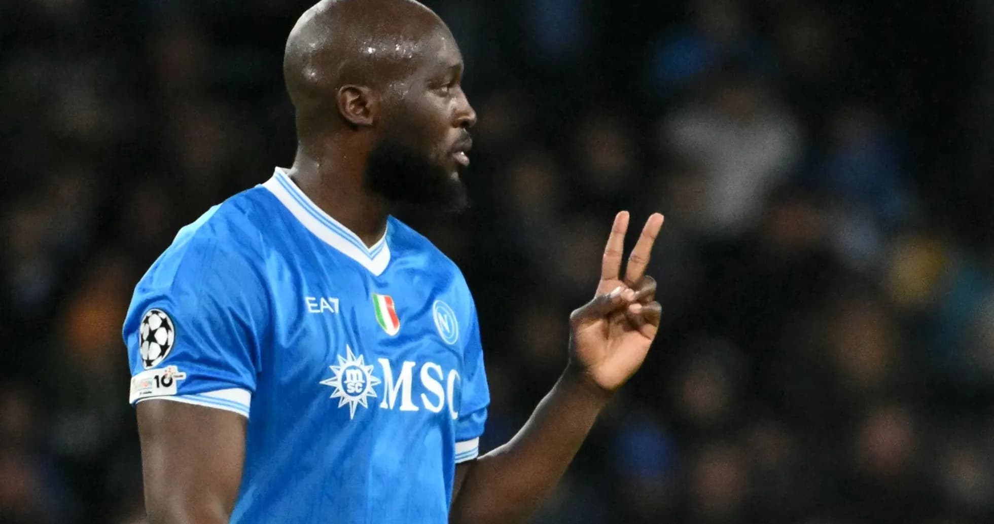 Player gesturing during a match in blue jersey