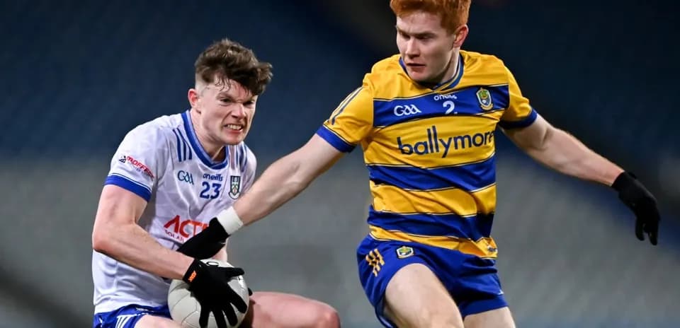 Two players contesting possession of the ball