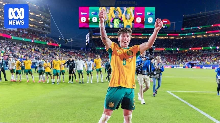 Player celebrating after match with teammates in background