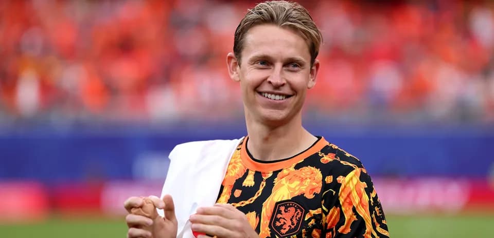 Player smiling in vibrant team-themed warm-up shirt