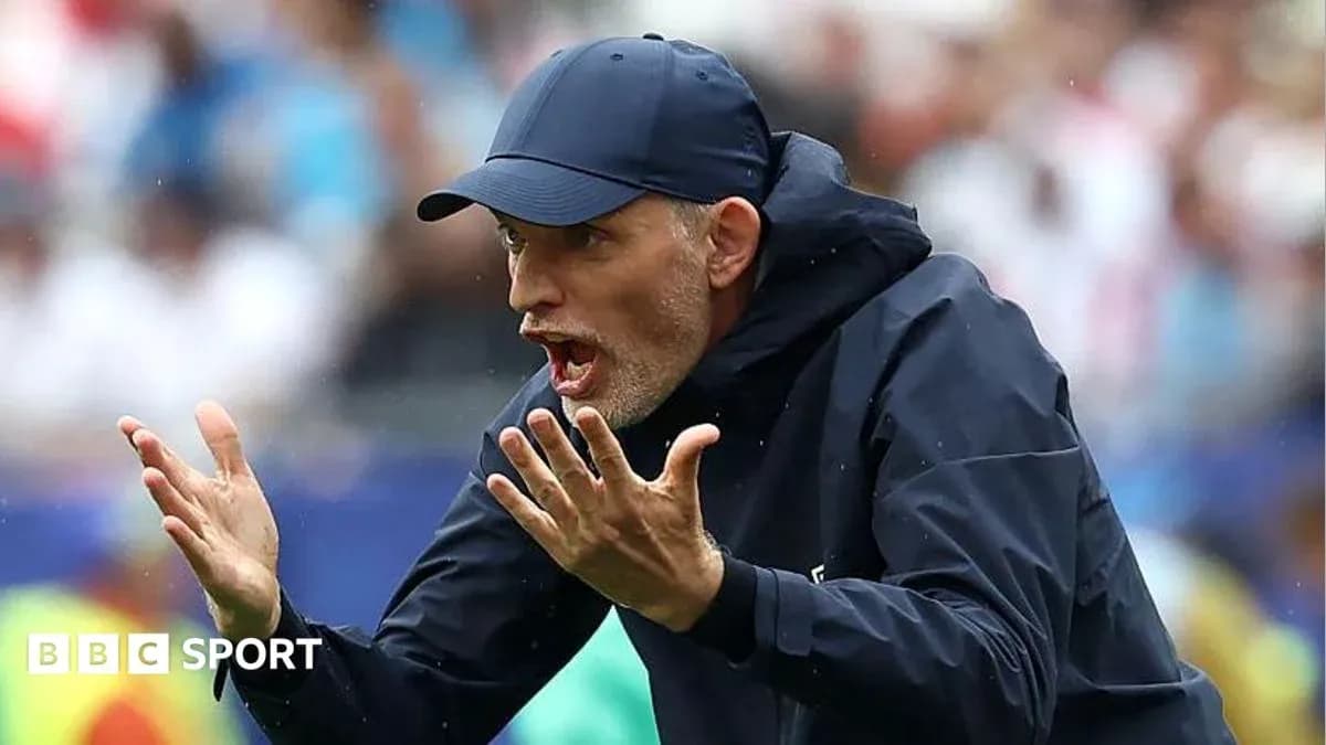 Coach gesturing passionately on the sideline