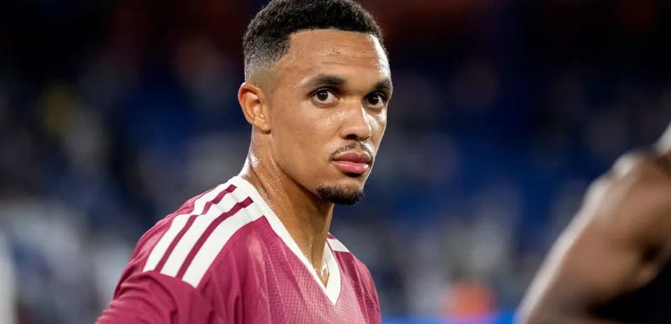Football player in maroon jersey during match