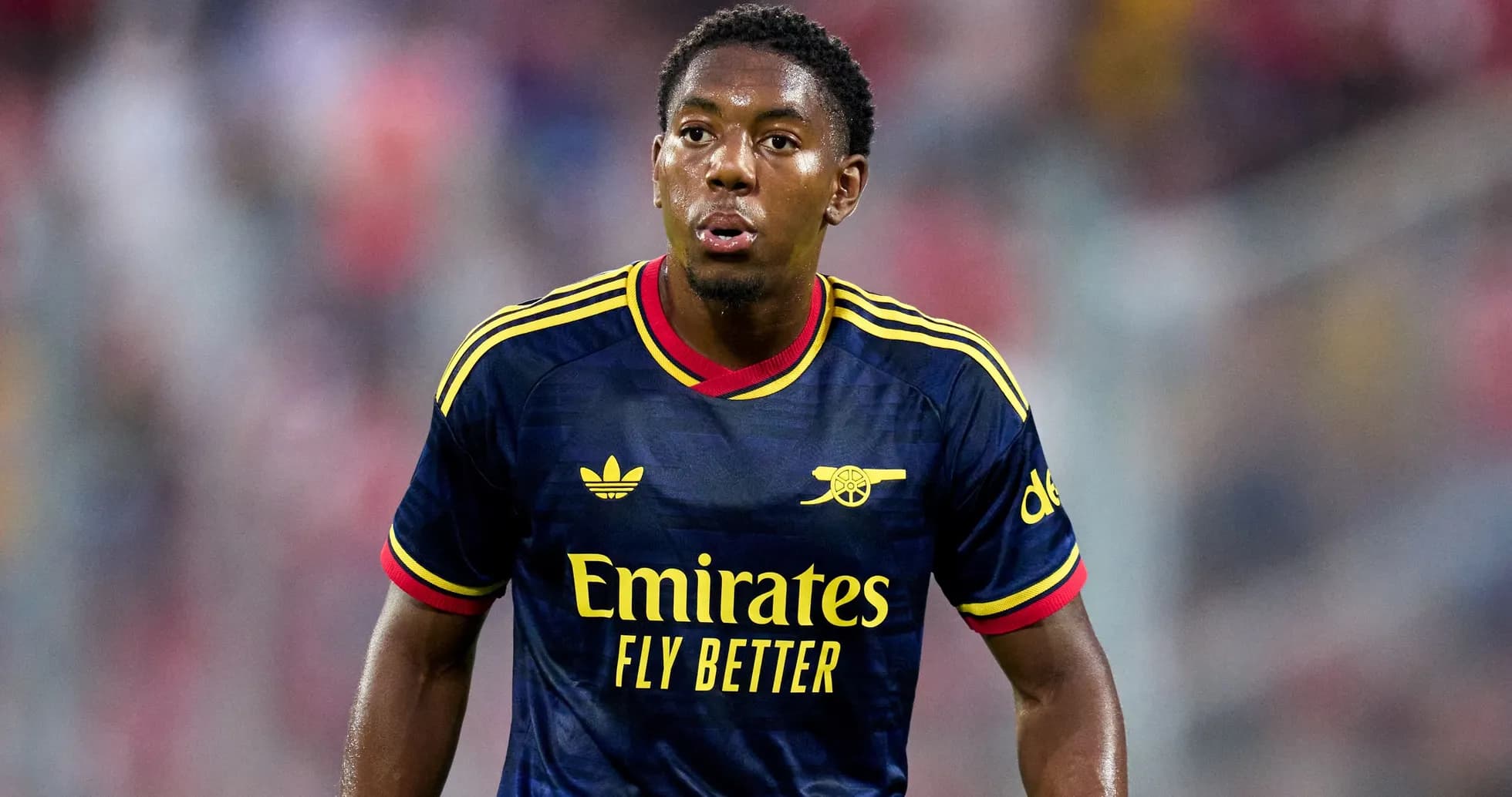 Football player in Arsenal kit during match