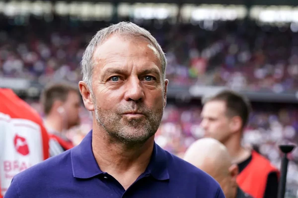 Coach standing on the sidelines during match
