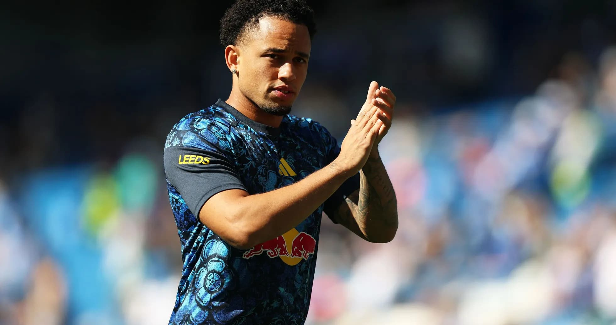 Player applauding fans during match warm-up