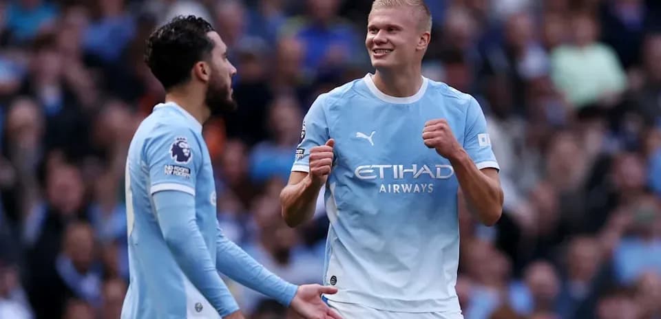 Manchester City players celebrating during match
