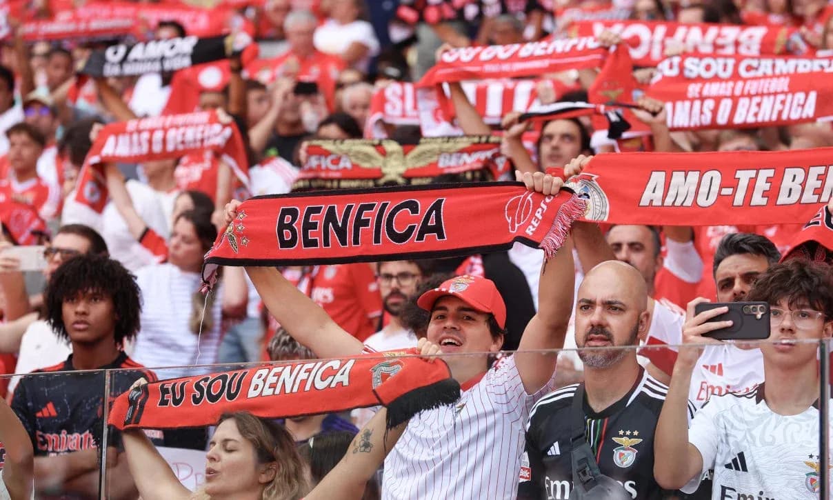Benfica fans cheering with scarves in stadium