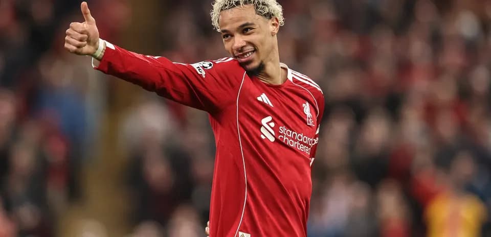 Player celebrating and giving thumbs up on field