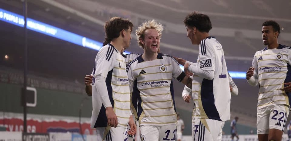 Players celebrating a goal during North Texas match