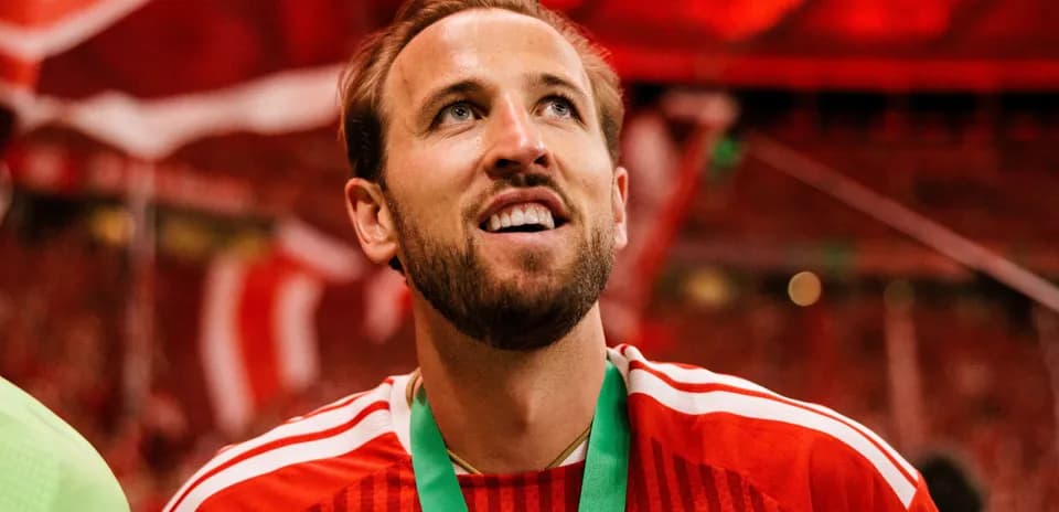 Player celebrating with medal in stadium