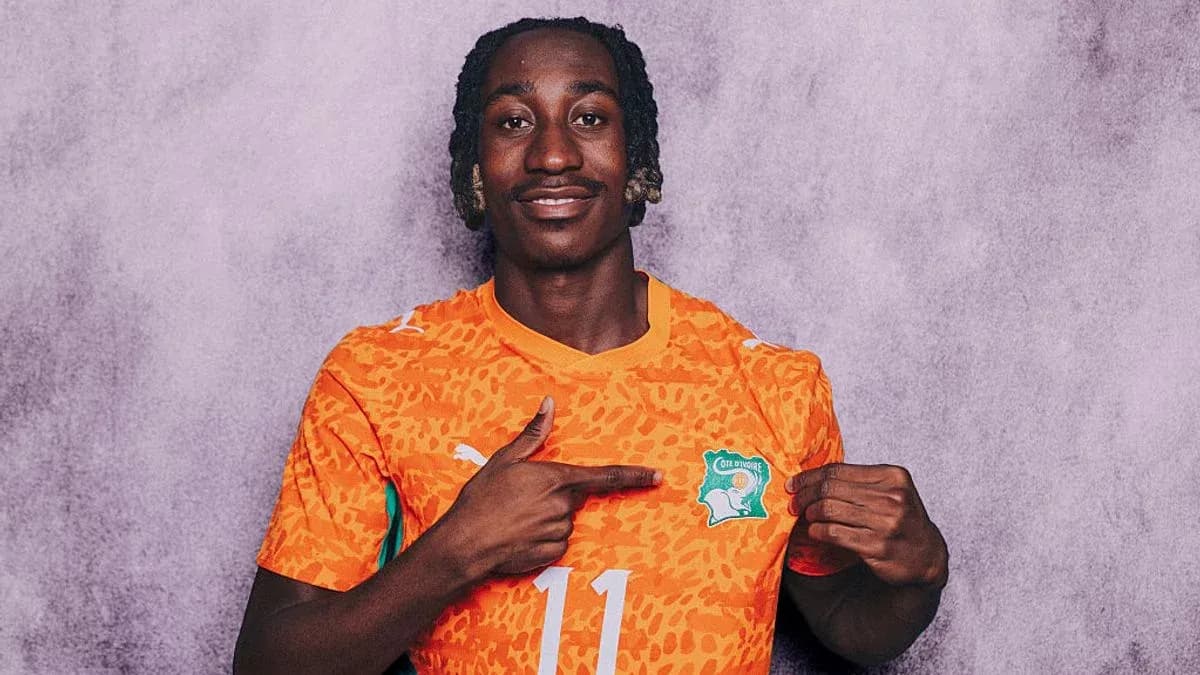 Player pointing at Ivory Coast national team logo