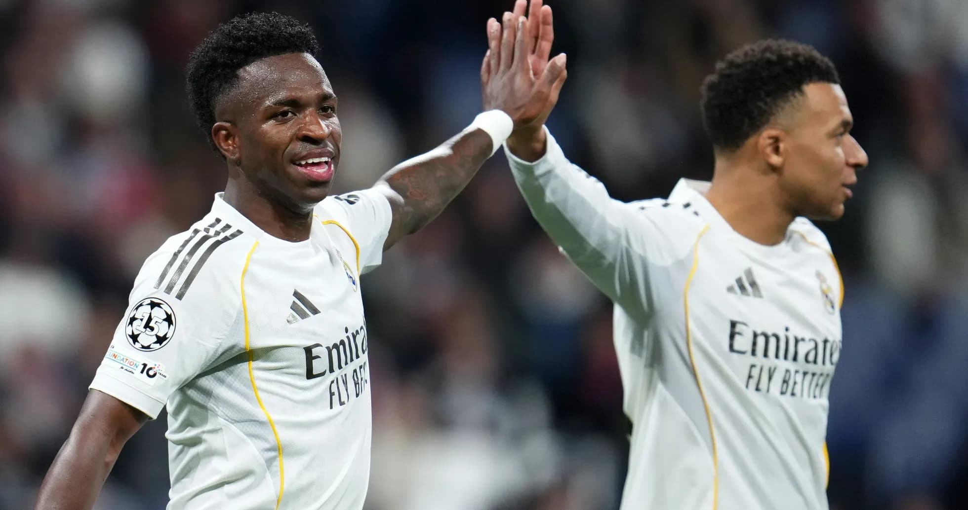 Vinícius Júnior and teammate celebrating during match