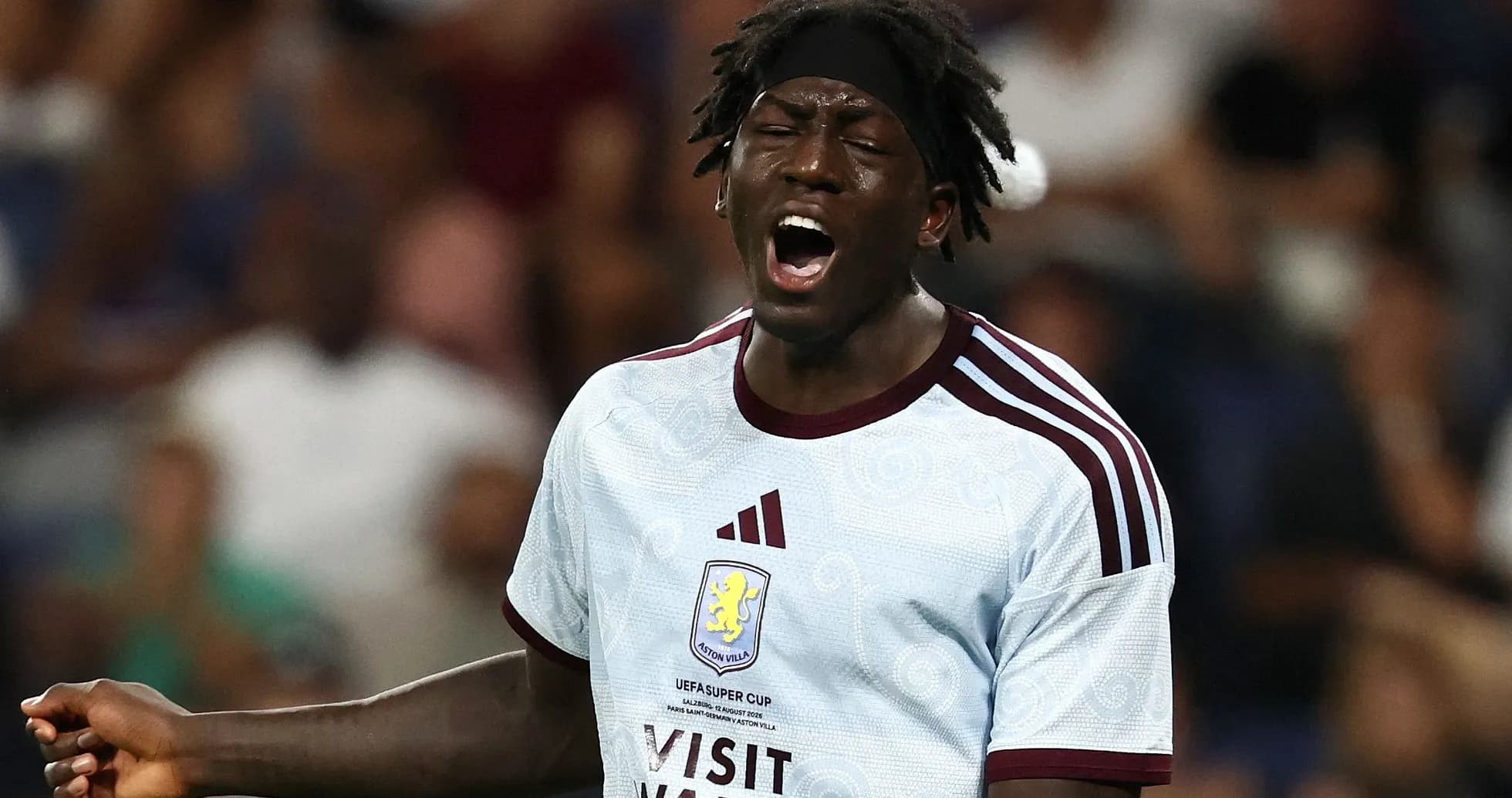Player in Aston Villa jersey shouting during match