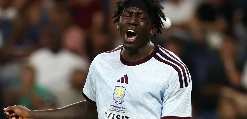 Player in Aston Villa jersey shouting during match
