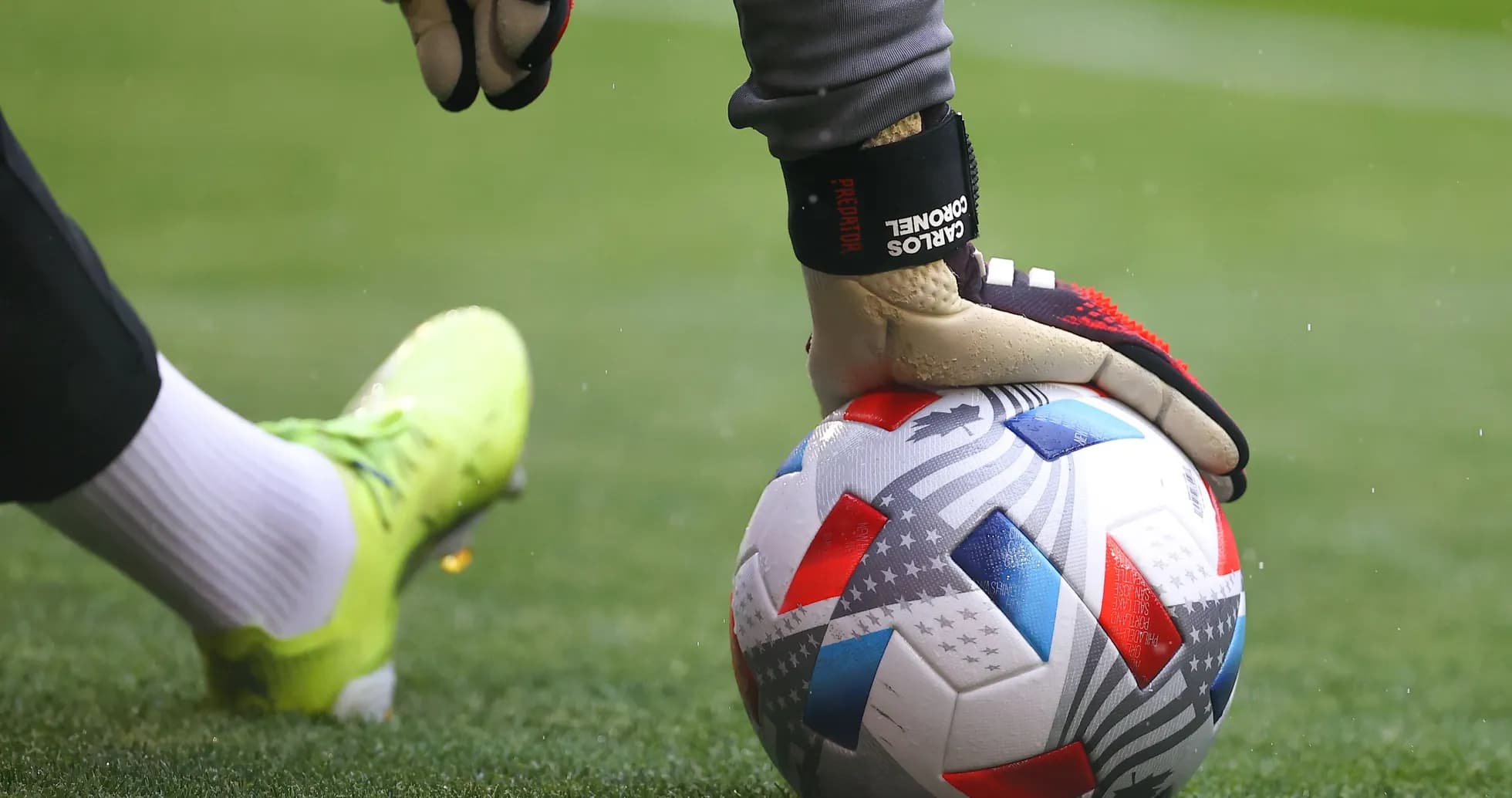 Goalkeeper preparing to kick a soccer ball