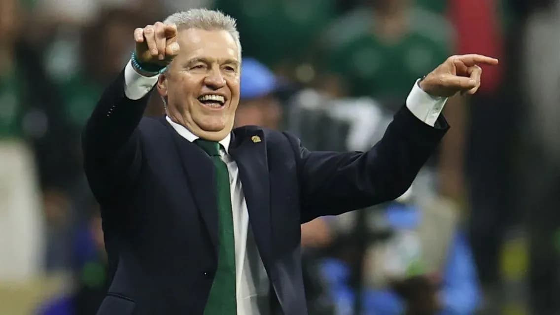 Coach celebrating and directing players during match