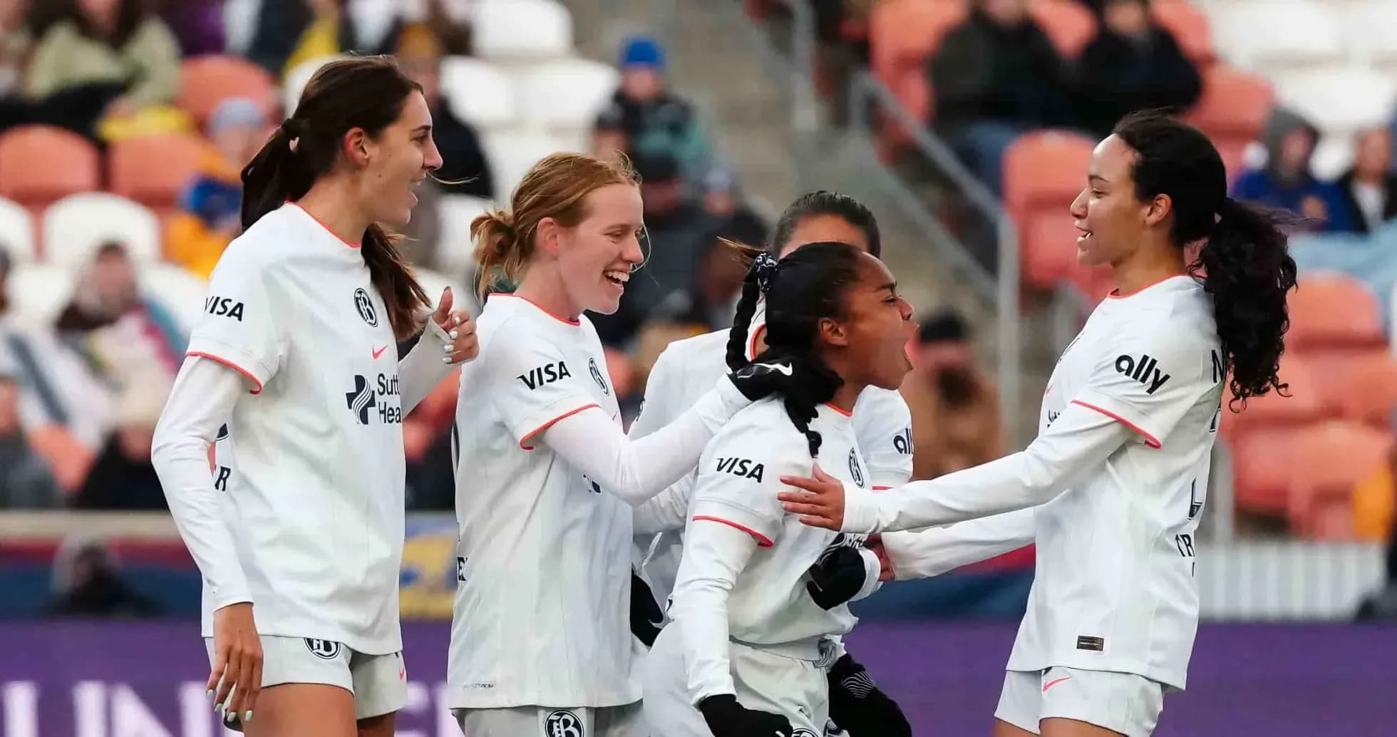 Players celebrating a goal during match