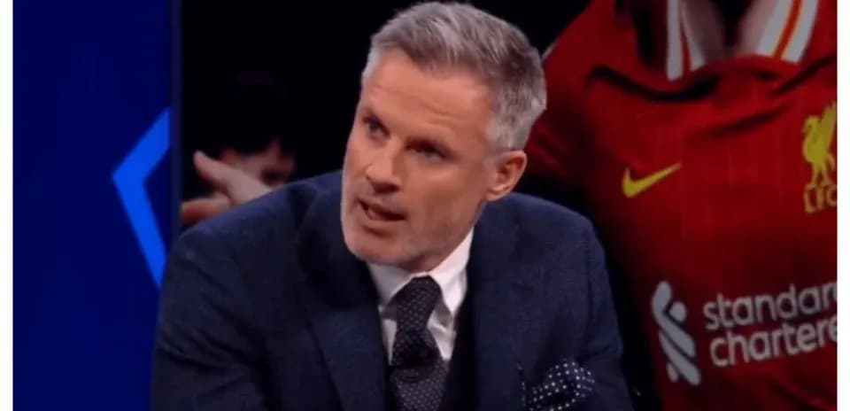 Football analyst speaking on set with Liverpool background