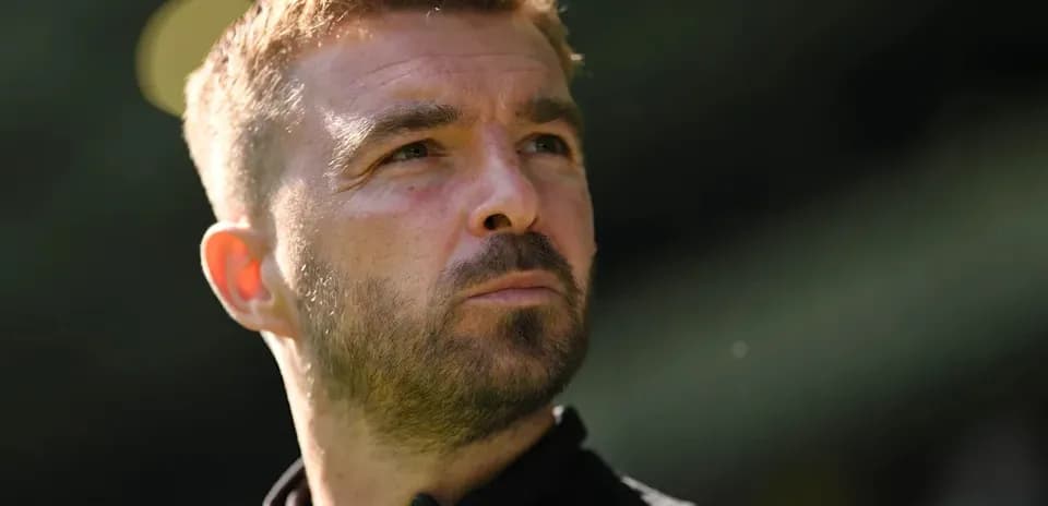 Close-up of a man looking thoughtfully outdoors