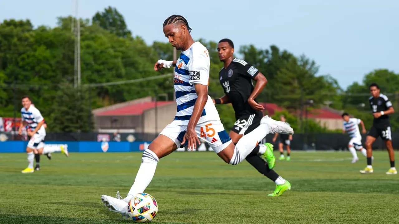 Player shooting the ball during Huntsville City match