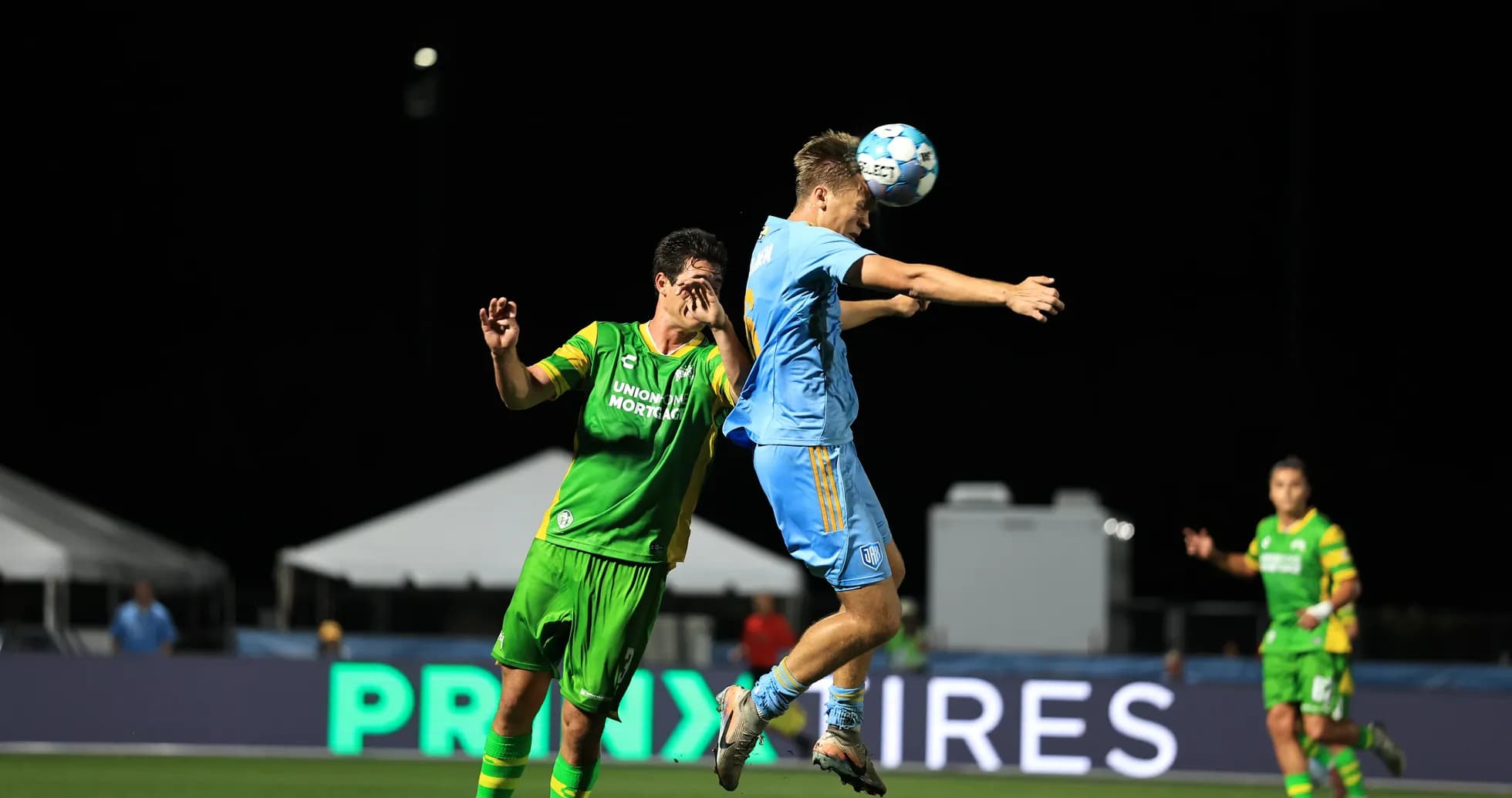 Player jumping for the ball during match