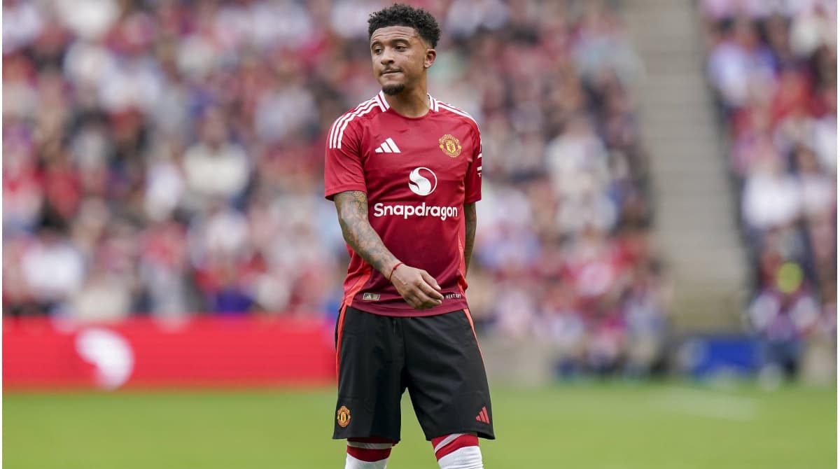 Jadon Sancho in Manchester United kit on pitch