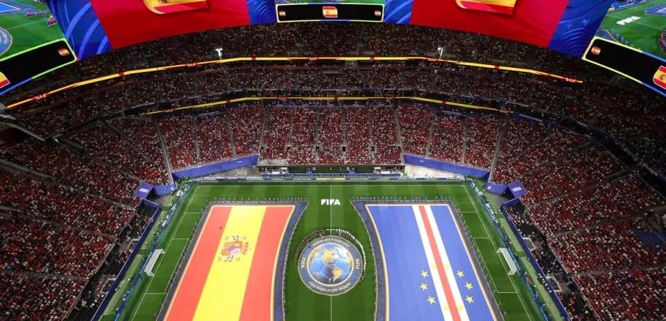 Stadium filled with fans and team flags displayed