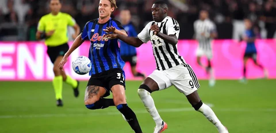 Player challenging for the ball during match