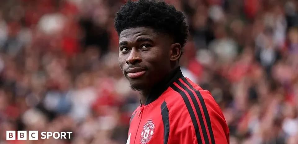 Player in Manchester United jersey at stadium