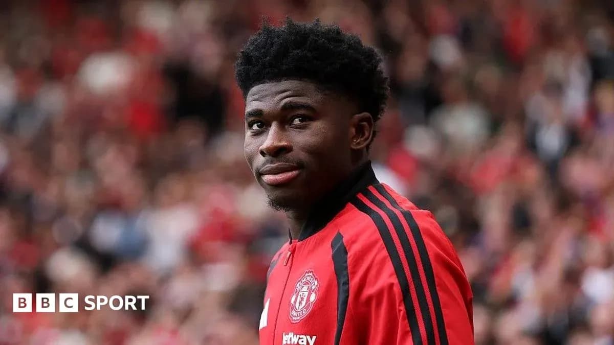 Player in Manchester United jersey at stadium