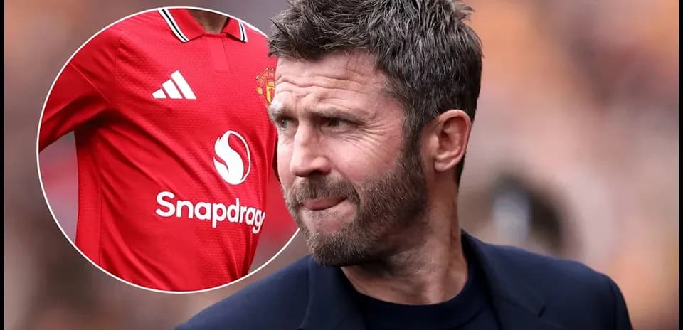 Coach observing match with Manchester United jersey displayed