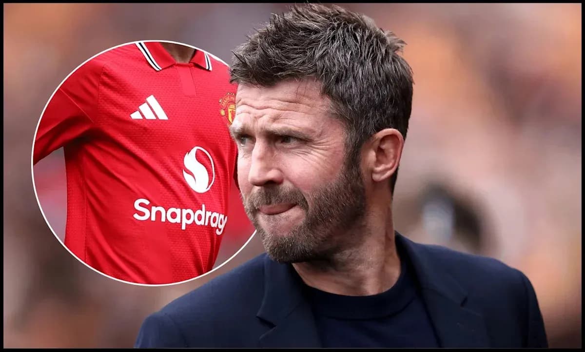 Coach observing match with Manchester United jersey displayed