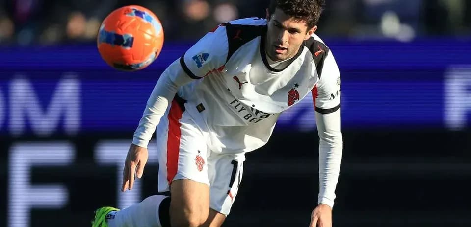Player in white jersey attempting to control ball