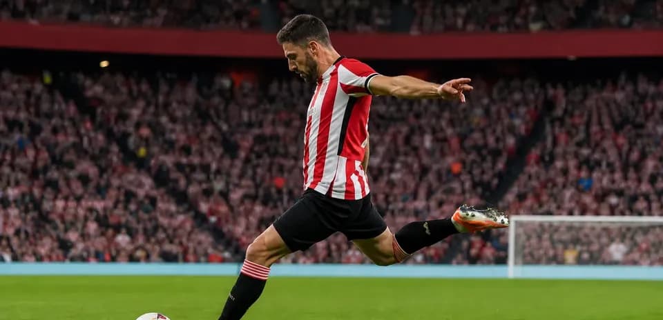 Player taking a free kick during a match